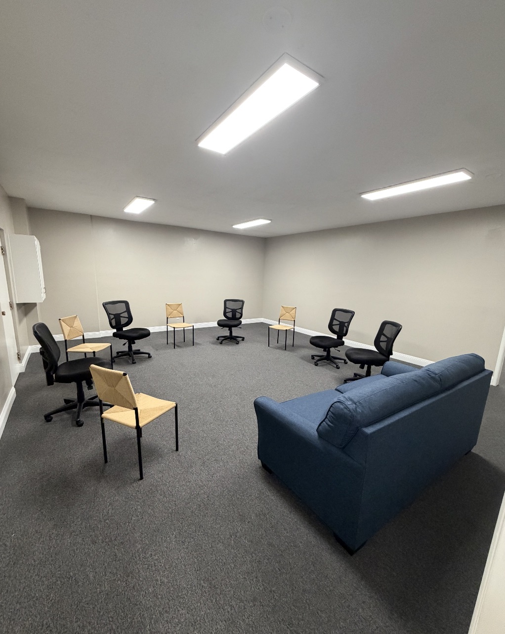 Group therapy room at Golden Coast Rehab in La Mesa with chairs arranged in a circle